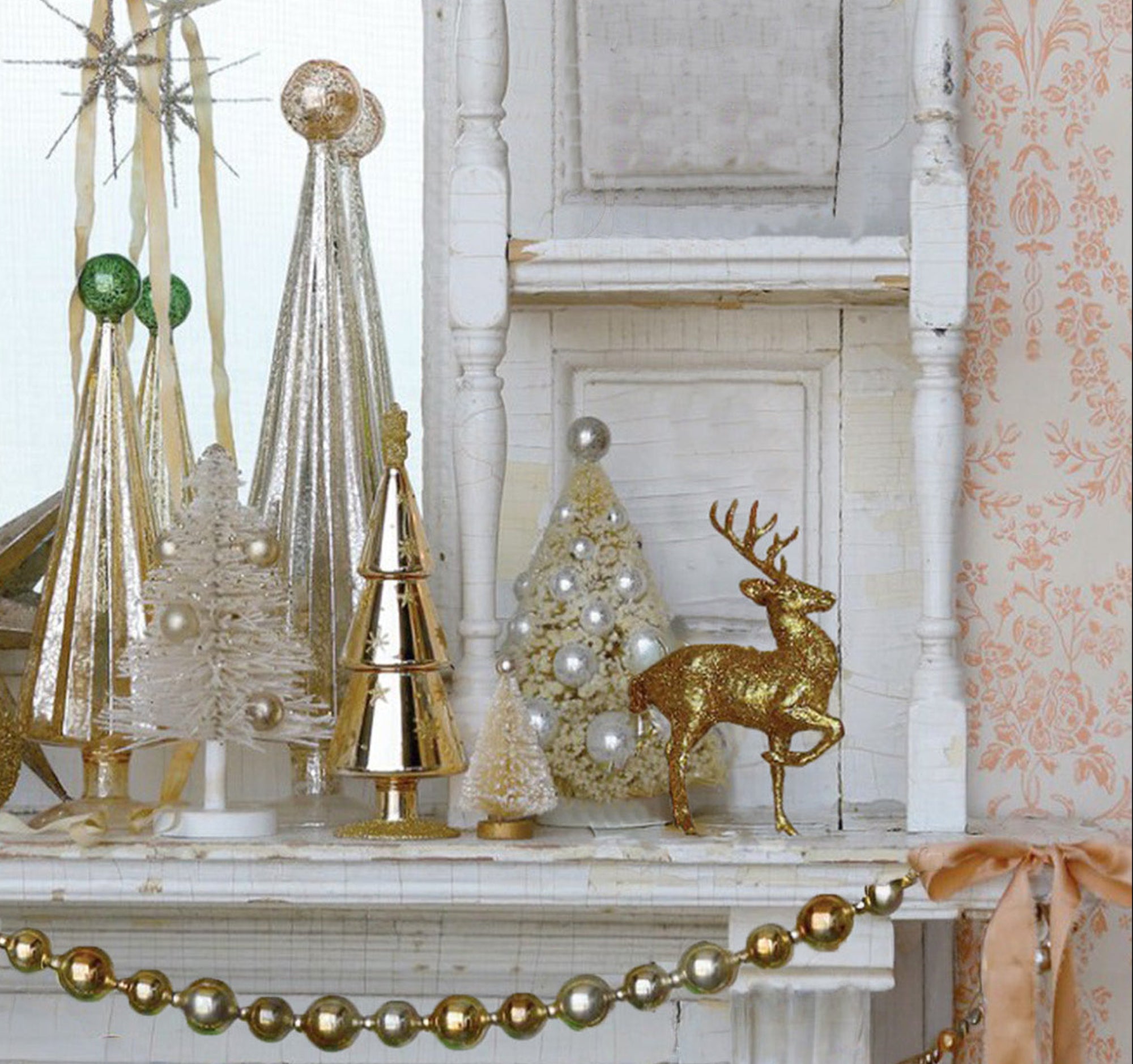 White and Gold Embelished Christmas Tree on a Mantel